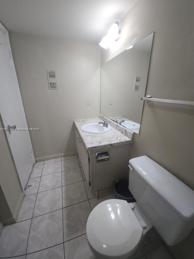 1500 N Congress Ave Unit B53, West Palm Beach, FL 33401 - bathroom featuring toilet, vanity, and tile patterned floors