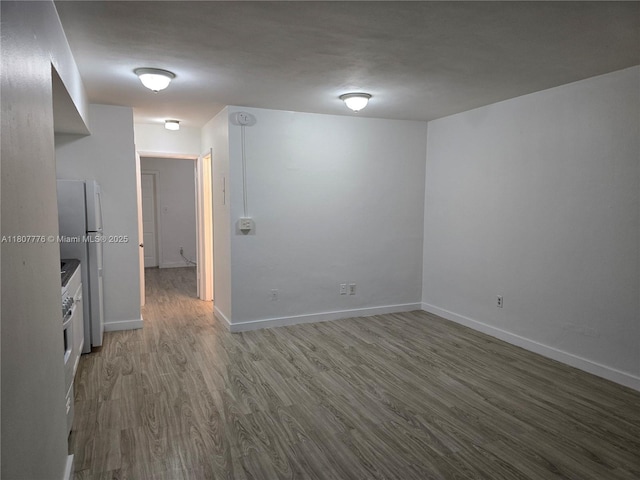 1140 71st St Unit 3, Miami Beach, FL 33141 - spare room featuring wood finished floors and baseboards