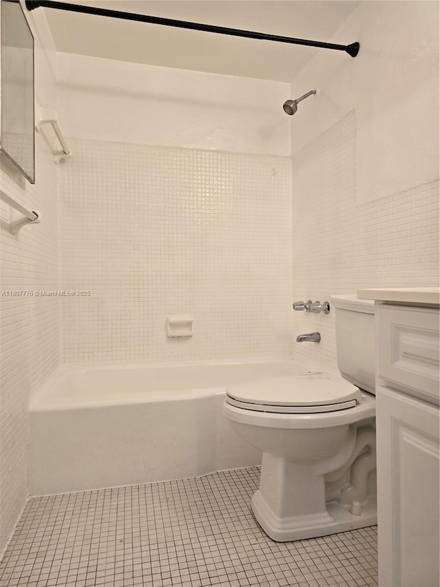 1140 71st St Unit 3, Miami Beach, FL 33141 - full bath featuring toilet, tile patterned floors, shower / bathtub combination, vanity, and tile walls