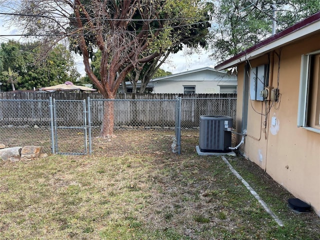 16320 SW 100th Ct, Miami, FL 33157 - view of yard with cooling unit and a gate