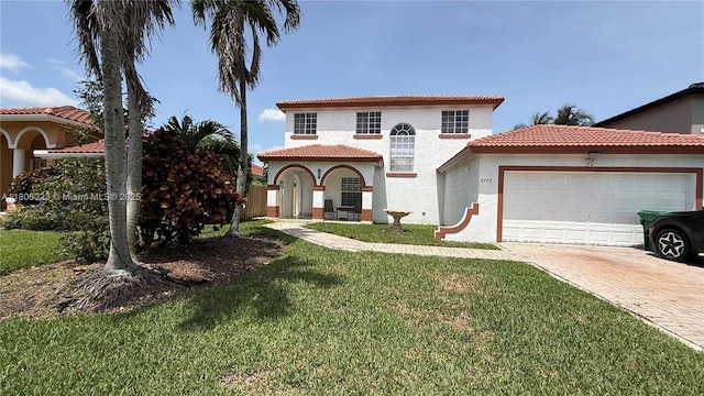 9772 SW 159th Ave, Miami, FL 33196 - mediterranean / spanish-style house featuring an attached garage, decorative driveway, a front yard, and stucco siding