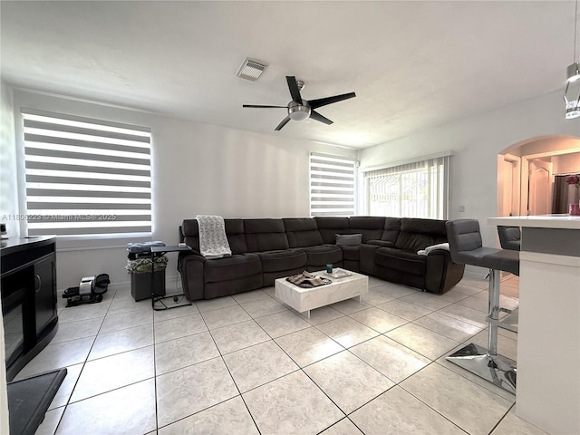 9772 SW 159th Ave, Miami, FL 33196 - living area with light tile patterned flooring, arched walkways, and a ceiling fan