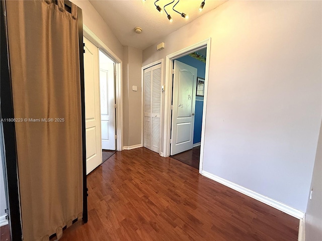 9772 SW 159th Ave, Miami, FL 33196 - corridor featuring dark wood-type flooring and baseboards
