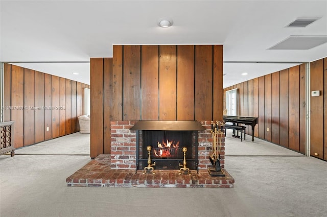 4465 SW 37th Ave, Dania Beach, FL 33312 - living room featuring carpet flooring, wood walls, and a fireplace