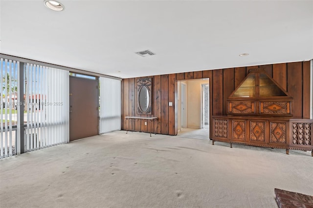 4465 SW 37th Ave, Dania Beach, FL 33312 - unfurnished living room with light colored carpet and wood walls