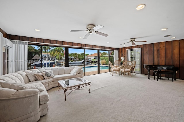 4465 SW 37th Ave, Dania Beach, FL 33312 - living area with an AC wall unit, wood walls, light colored carpet, a ceiling fan, and recessed lighting