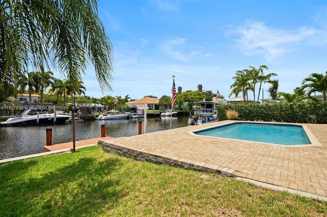 4465 SW 37th Ave, Dania Beach, FL 33312 - view of swimming pool featuring a water view, a yard, a boat dock, and a patio