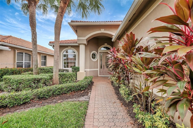 9212 Short Chip Cir, Port St Lucie, FL 34986 - doorway to property featuring stucco siding and a tiled roof