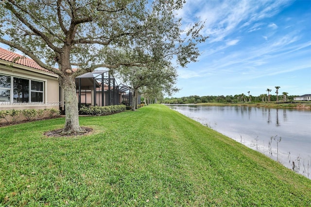 9212 Short Chip Cir, Port St Lucie, FL 34986 - view of green lawn featuring a water view and a lanai