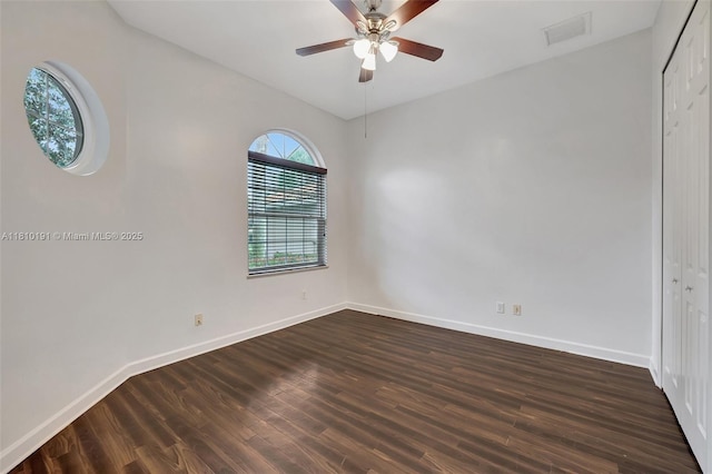 9212 Short Chip Cir, Port St Lucie, FL 34986 - empty room with baseboards, dark wood finished floors, and ceiling fan