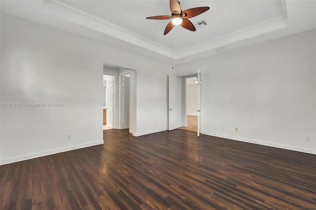 9212 Short Chip Cir, Port St Lucie, FL 34986 - spare room featuring a tray ceiling, a ceiling fan, baseboards, wood finished floors, and crown molding