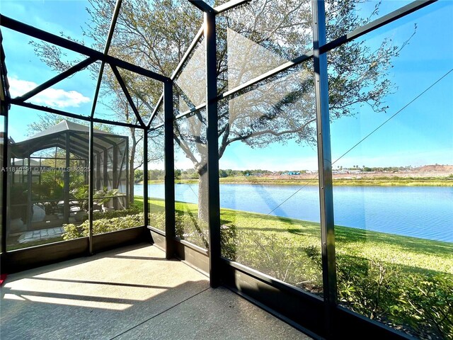 9212 Short Chip Cir, Port St Lucie, FL 34986 - unfurnished sunroom featuring a water view