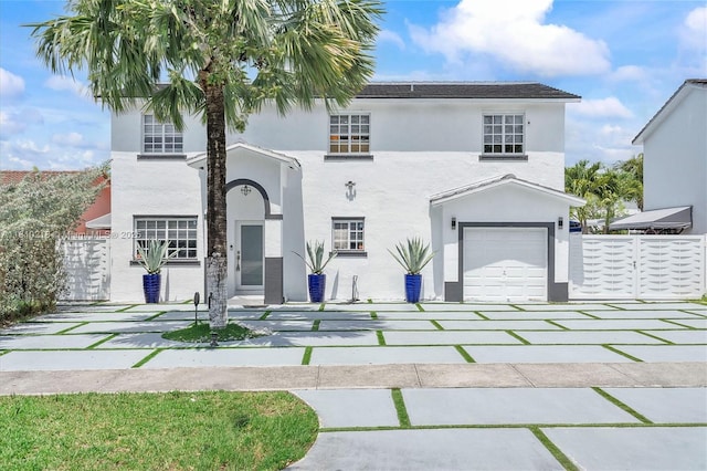 18110 SW 153rd Ct, Miami, FL 33187 - view of front of home with stucco siding, an attached garage, and driveway