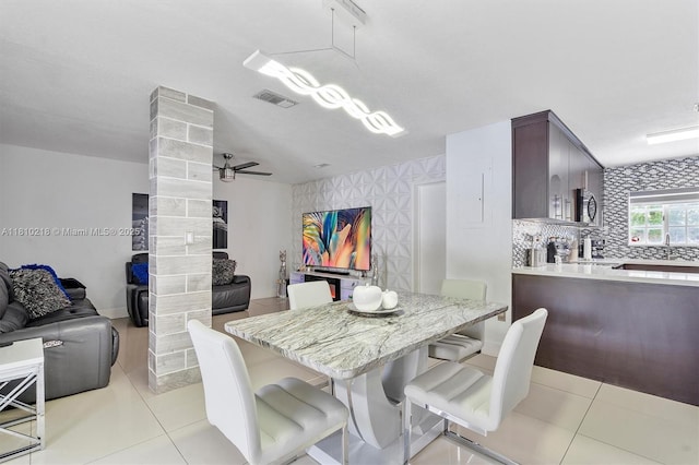 18110 SW 153rd Ct, Miami, FL 33187 - dining room featuring light tile patterned floors, decorative columns, and a ceiling fan
