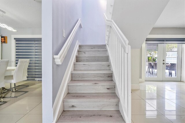 18110 SW 153rd Ct, Miami, FL 33187 - staircase featuring tile patterned floors and french doors
