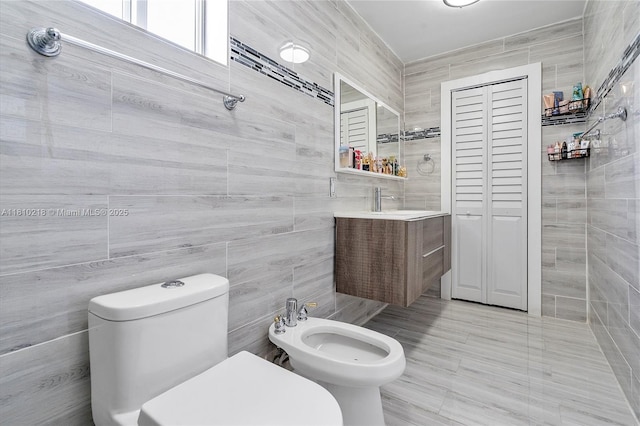 18110 SW 153rd Ct, Miami, FL 33187 - bathroom with tile walls, a bidet, vanity, and a closet