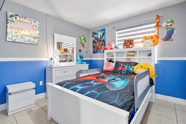 18110 SW 153rd Ct, Miami, FL 33187 - bedroom with a textured ceiling and light tile patterned floors
