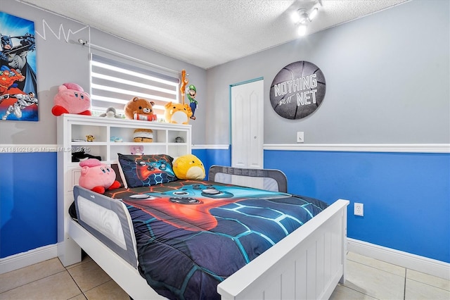 18110 SW 153rd Ct, Miami, FL 33187 - tiled bedroom featuring a textured ceiling