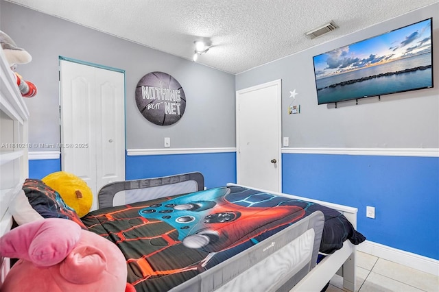 18110 SW 153rd Ct, Miami, FL 33187 - tiled bedroom with a closet and a textured ceiling