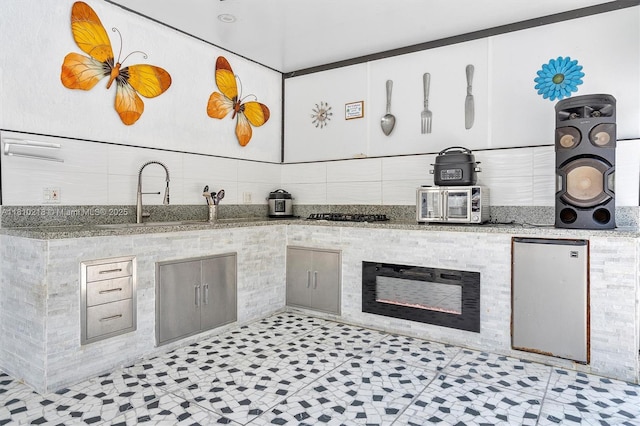 18110 SW 153rd Ct, Miami, FL 33187 - kitchen with stone countertops, gas stovetop, and tasteful backsplash