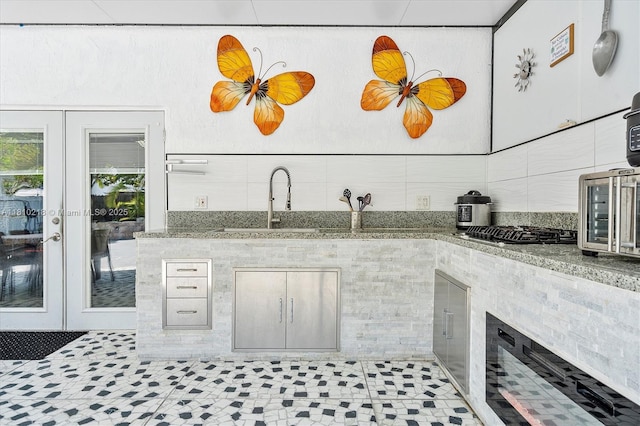 18110 SW 153rd Ct, Miami, FL 33187 - kitchen featuring french doors, stainless steel gas cooktop, and decorative backsplash