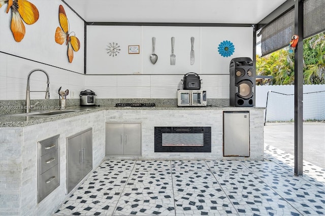 18110 SW 153rd Ct, Miami, FL 33187 - kitchen featuring light stone counters, gas stovetop, and refrigerator
