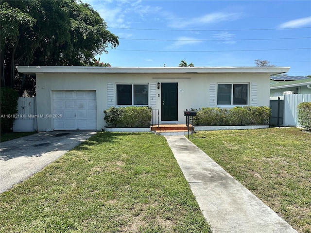 2609 Arthur St, Hollywood, FL 33020 - ranch-style house with stucco siding, driveway, and a garage