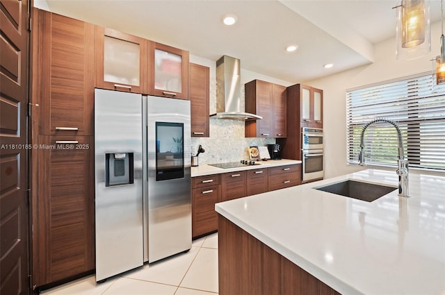 9145 NW 154th Ter, Miami Lakes, FL 33018 - kitchen featuring appliances with stainless steel finishes, wall chimney range hood, a sink, light countertops, and recessed lighting