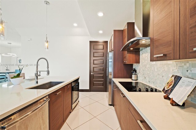 9145 NW 154th Ter, Miami Lakes, FL 33018 - kitchen featuring appliances with stainless steel finishes, a sink, wall chimney range hood, modern cabinets, and light countertops