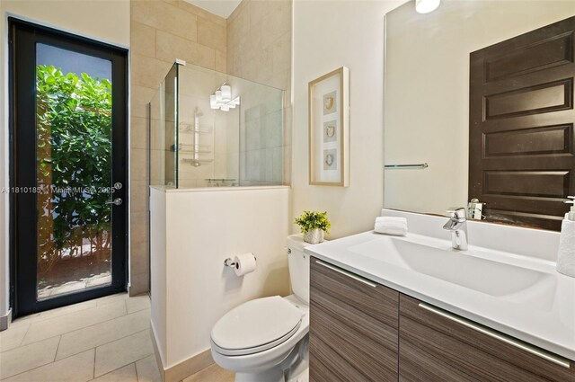 9145 NW 154th Ter, Miami Lakes, FL 33018 - full bath featuring vanity, a walk in shower, tile patterned floors, toilet, and baseboards