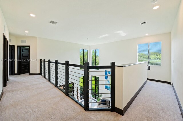 9145 NW 154th Ter, Miami Lakes, FL 33018 - corridor with carpet flooring, baseboards, healthy amount of natural light, recessed lighting, and an upstairs landing