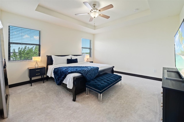 9145 NW 154th Ter, Miami Lakes, FL 33018 - bedroom with light carpet, a tray ceiling, baseboards, and a ceiling fan