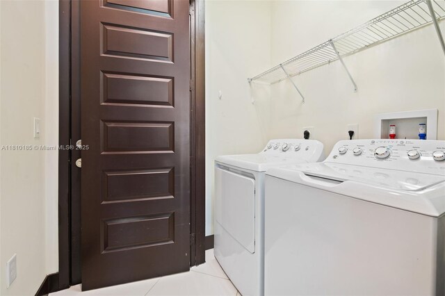 9145 NW 154th Ter, Miami Lakes, FL 33018 - laundry room with independent washer and dryer and light tile patterned flooring