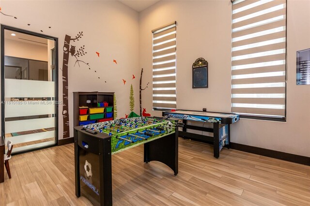 9145 NW 154th Ter, Miami Lakes, FL 33018 - rec room featuring healthy amount of natural light, light wood-style flooring, and baseboards