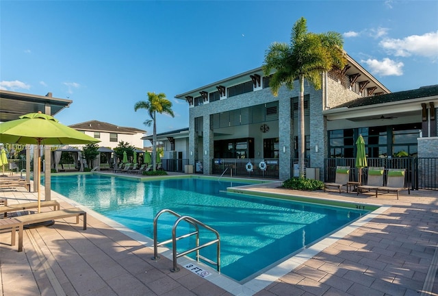 9145 NW 154th Ter, Miami Lakes, FL 33018 - community pool with a patio area and ceiling fan