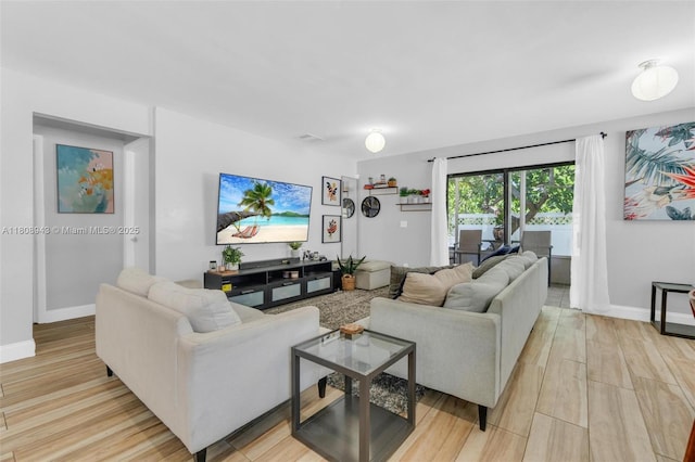 2412 Raleigh St, Hollywood, FL 33020 - living room with light wood finished floors and baseboards