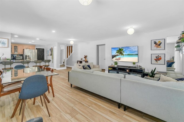 2412 Raleigh St, Hollywood, FL 33020 - living area featuring stairs, recessed lighting, light wood finished floors, and baseboards