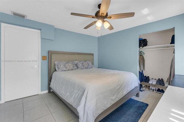 2412 Raleigh St, Hollywood, FL 33020 - bedroom with light tile patterned flooring, a closet, ceiling fan, and baseboards