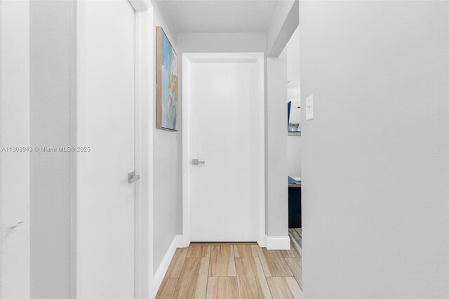 2412 Raleigh St, Hollywood, FL 33020 - corridor featuring light wood finished floors and baseboards