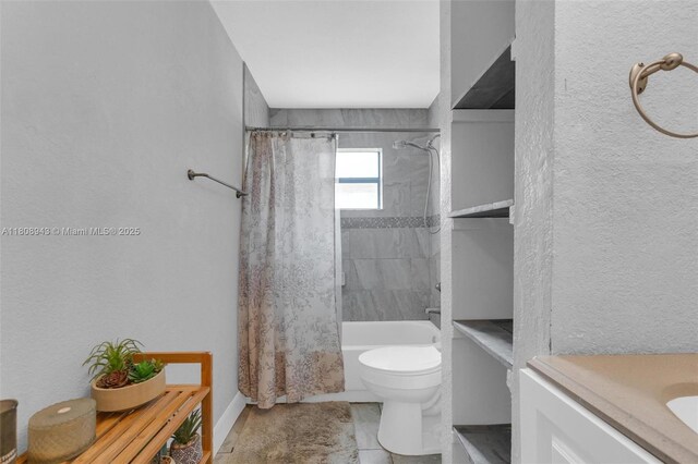 2412 Raleigh St, Hollywood, FL 33020 - full bathroom with shower / tub combo with curtain, toilet, vanity, and a textured wall