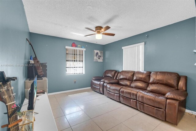 2412 Raleigh St, Hollywood, FL 33020 - living area featuring a ceiling fan, baseboards, a textured ceiling, and light tile patterned flooring