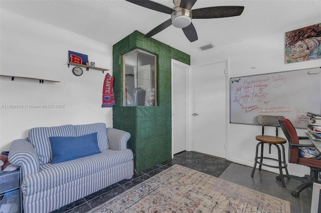 2412 Raleigh St, Hollywood, FL 33020 - living area featuring a textured ceiling, ceiling fan, and granite tiled floors