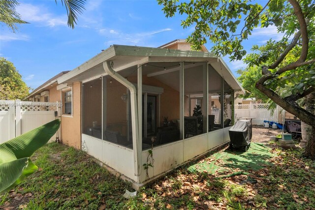 2412 Raleigh St, Hollywood, FL 33020 - view of home's exterior with a sunroom