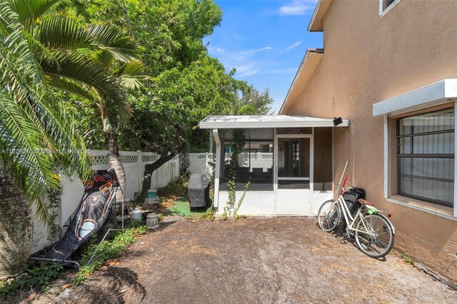 2412 Raleigh St, Hollywood, FL 33020 - fenced backyard with a sunroom