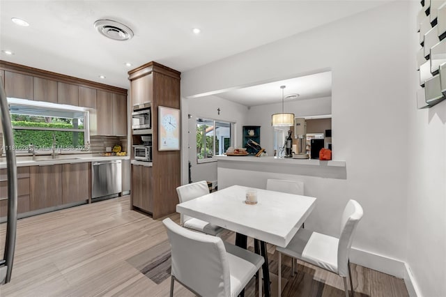 259 E Shore Dr E, Miami, FL 33133 - dining space with recessed lighting and light wood finished floors
