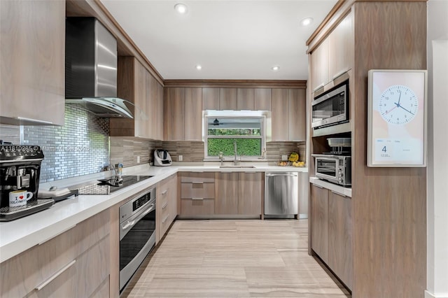 259 E Shore Dr E, Miami, FL 33133 - kitchen featuring stainless steel appliances, wall chimney exhaust hood, modern cabinets, light countertops, and recessed lighting