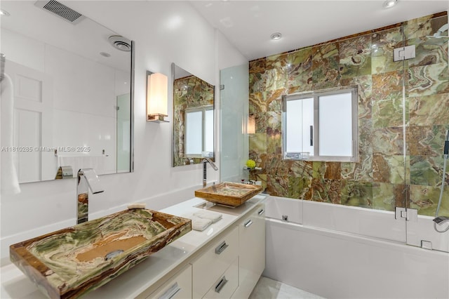 259 E Shore Dr E, Miami, FL 33133 - full bathroom featuring double vanity, a tub, and recessed lighting