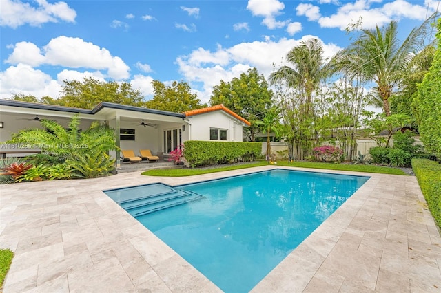 259 E Shore Dr E, Miami, FL 33133 - view of swimming pool featuring a ceiling fan and a patio area