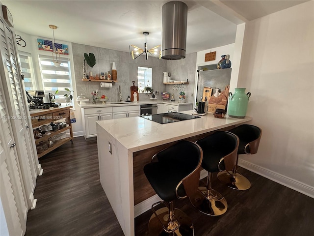 15223 SW 152nd Ave, Miami, FL 33187 - kitchen with open shelves, black electric stovetop, and dark wood finished floors