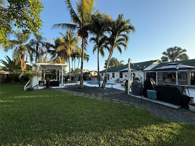 15223 SW 152nd Ave, Miami, FL 33187 - view of green lawn featuring a patio